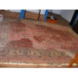 A carpet with floral centre medallion and geometri