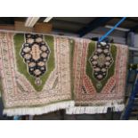 A pair of small Middle Eastern style rugs with gre