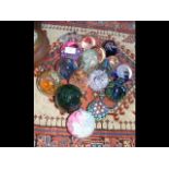 A collection of seventeen glass paperweights