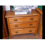 An antique three drawer chest