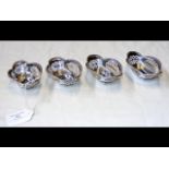 A set of four pierced silver miniature sweet meat