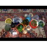 A collection of seventeen glass paperweights