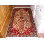 A Middle Eastern style rug with geometric border -