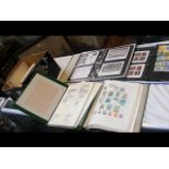 A large collection of stamps, albums, packs and co