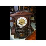 An oak cased two train mantel clock, together with