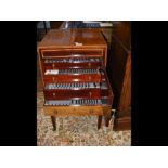 An early 20th century inlaid mahogany four drawer