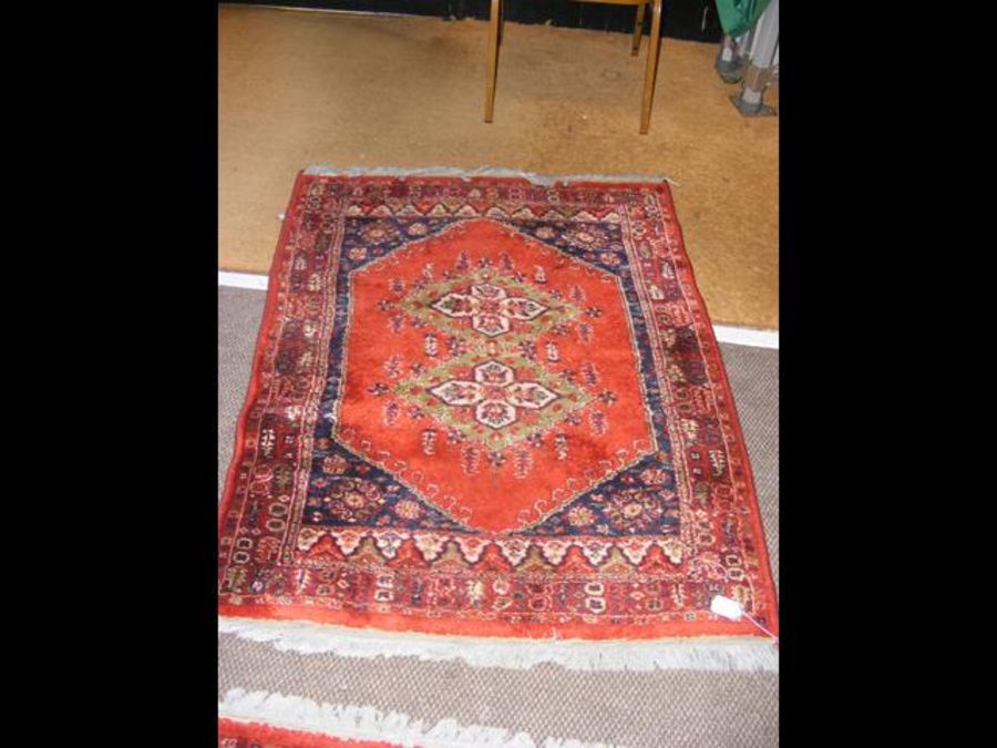 A Middle Eastern rug with geometric border - 137cm