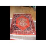 A Middle Eastern rug with geometric border - 137cm
