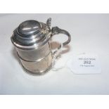 A small silver mustard pot in the form of a tankar