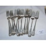 Fourteen silver dessert forks - 17 ounces