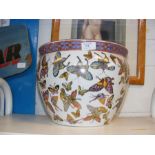 Oriental style jardiniere decorated with butterfli