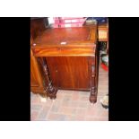 A Victorian walnut Davenport with cupboard under -