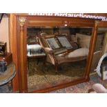 A mahogany bevelled over-mantel mirror with reeded