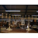 A pair of ecclesiastical brass adjustable candelab