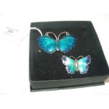An enamel butterfly brooch together with one other