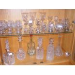 Two shelves of glassware including cut glass decan