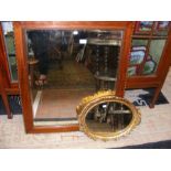A rosewood framed square wall mirror together with