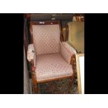 A 19th century armchair with reeded legs on castors