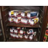 Two shelves of collectable boxed die-cast trucks,