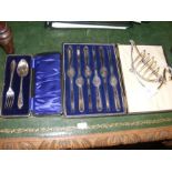 An unusual toast rack, a cased set of six silver p