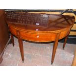 A Georgian inlaid mahogany demi lune tea table on