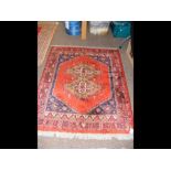 A Middle Eastern rug with geometric border - 137cm