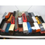 A tray of unboxed train wagons, containers