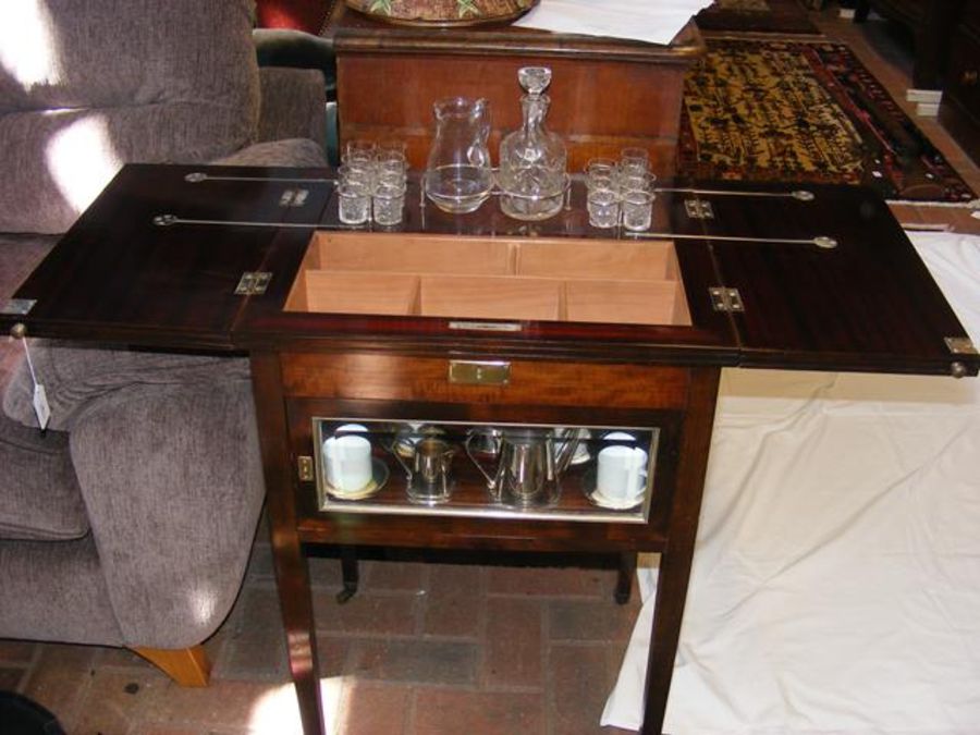 An unusual mahogany cased drinks cabinet with pop-