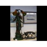 A large figural table lamp, together with vintage