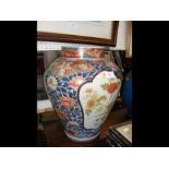 A large Oriental Imari vase - 38cms high with repa