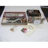 A box containing costume jewellery, wrist watches,