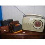 A vintage Bush radio, together with binoculars, et