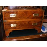 A reproduction yew wood chest with sunken brass