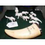 Miniature carved animals, together with a tooth me