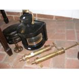 A vintage masthead lamp, two brass pumps, etc.