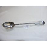 A large silver basting spoon with London hallmark