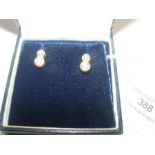 A pair of diamond mounted 14ct stud earrings