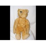 An old Steiff straw filled Teddy with glass eyes a