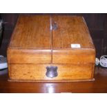 A Victorian oak stationery box