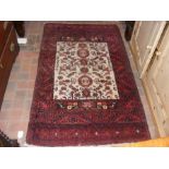 A Middle Eastern light ground rug with red border