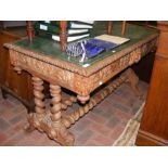 A Victorian carved oak centre table with inset gre
