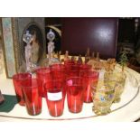 A medley of sundry items including cranberry glass