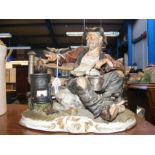 A vintage Capodimonte tramp on rock signed to back