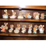 Two shelves of collectable Pendelfin ornaments, in
