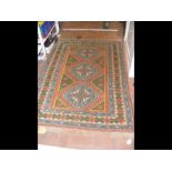 A small Turkish style rug with geometric border -