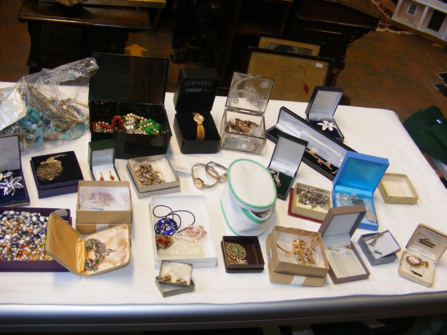 A selection of costume jewellery including watches