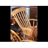 A slat back rocking chair