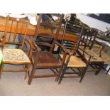 Four old wooden armchairs together with a footstoo