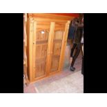 A pine display cabinet with glazed doors - width 7