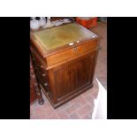 A 19th century oak Davenport desk with sliding top